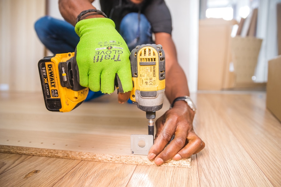 construction worker fastening screw