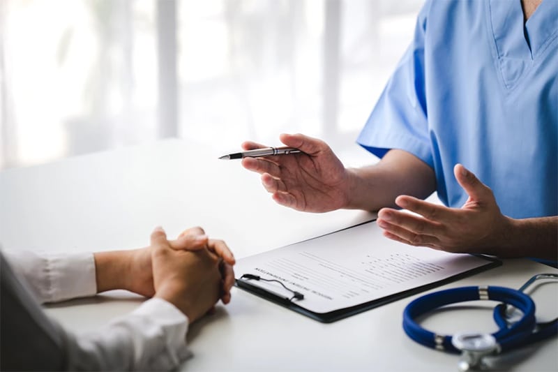 doctor explaining things to burn injury patient