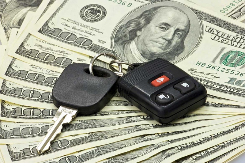 Person reviewing car accident insurance paperwork and medical bills
