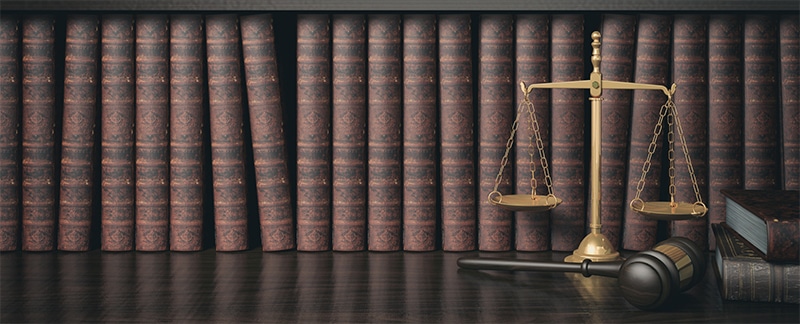 scales of justice near law books