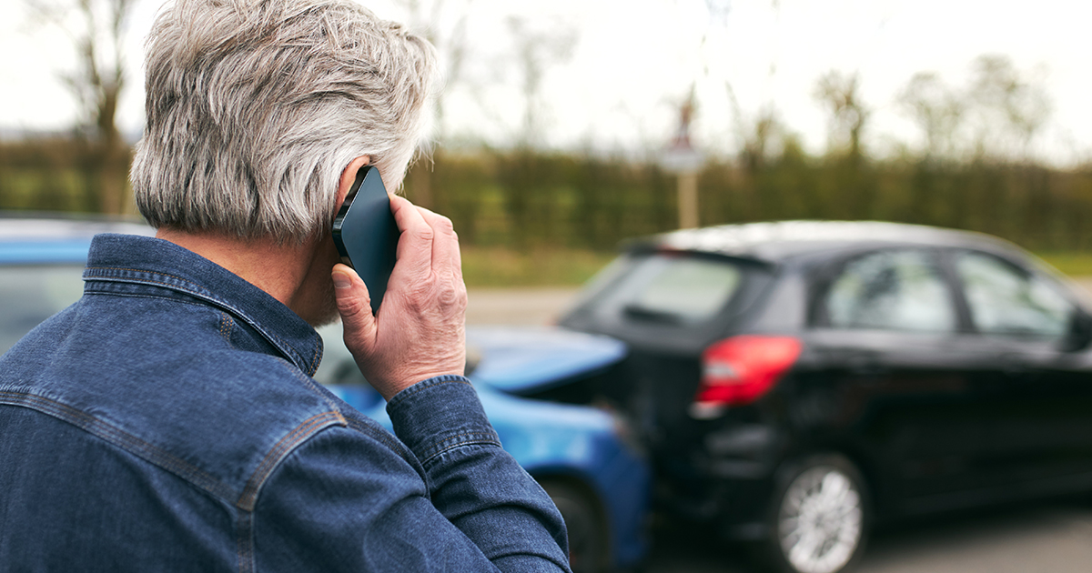 man on phone after rear-end car accident