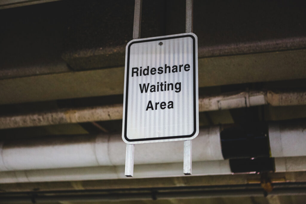 sign with rideshare waiting area on it