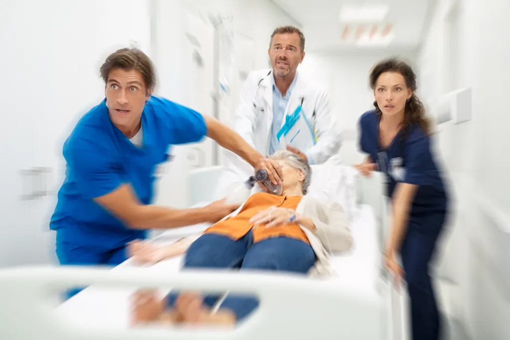doctors rushing patient in ER