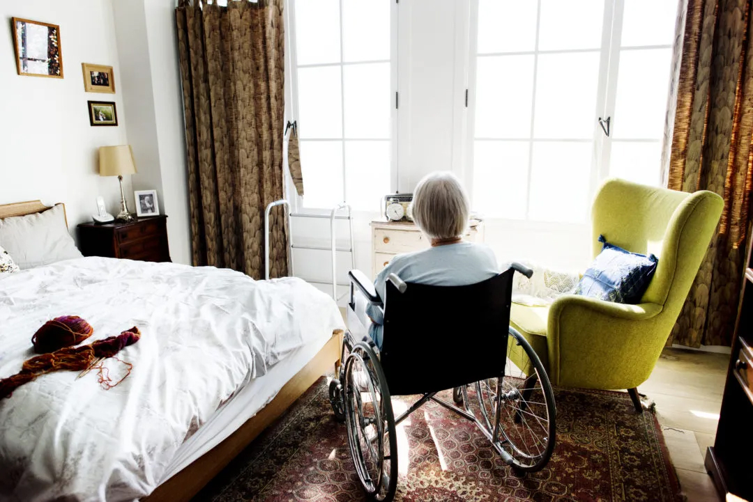 elderly woman in wheel chair