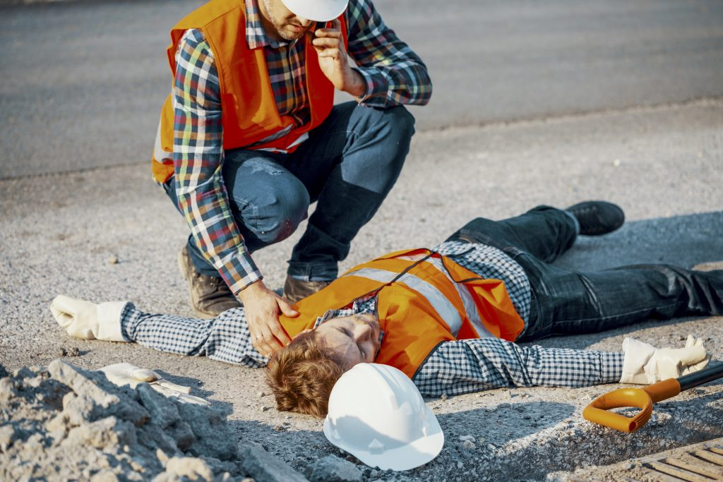 construction workers injured and laying on graound