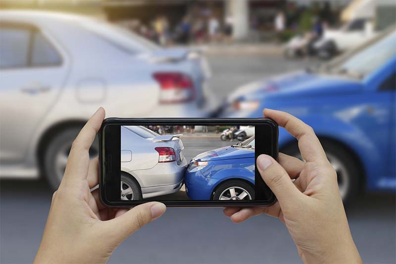 Take Photos or Videos of the Accident Scene, Including Damages and Road Conditions