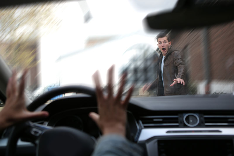 Man about to be hit by car