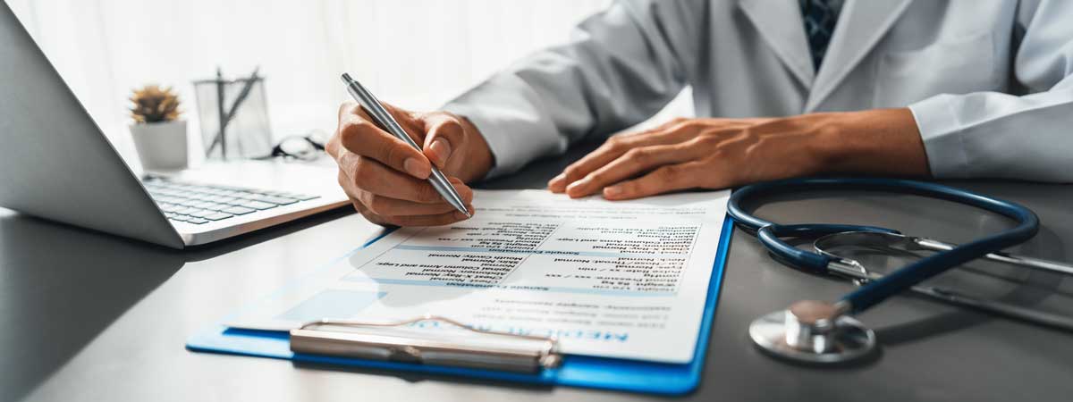 image of a doctor filing out a medical evaluation form